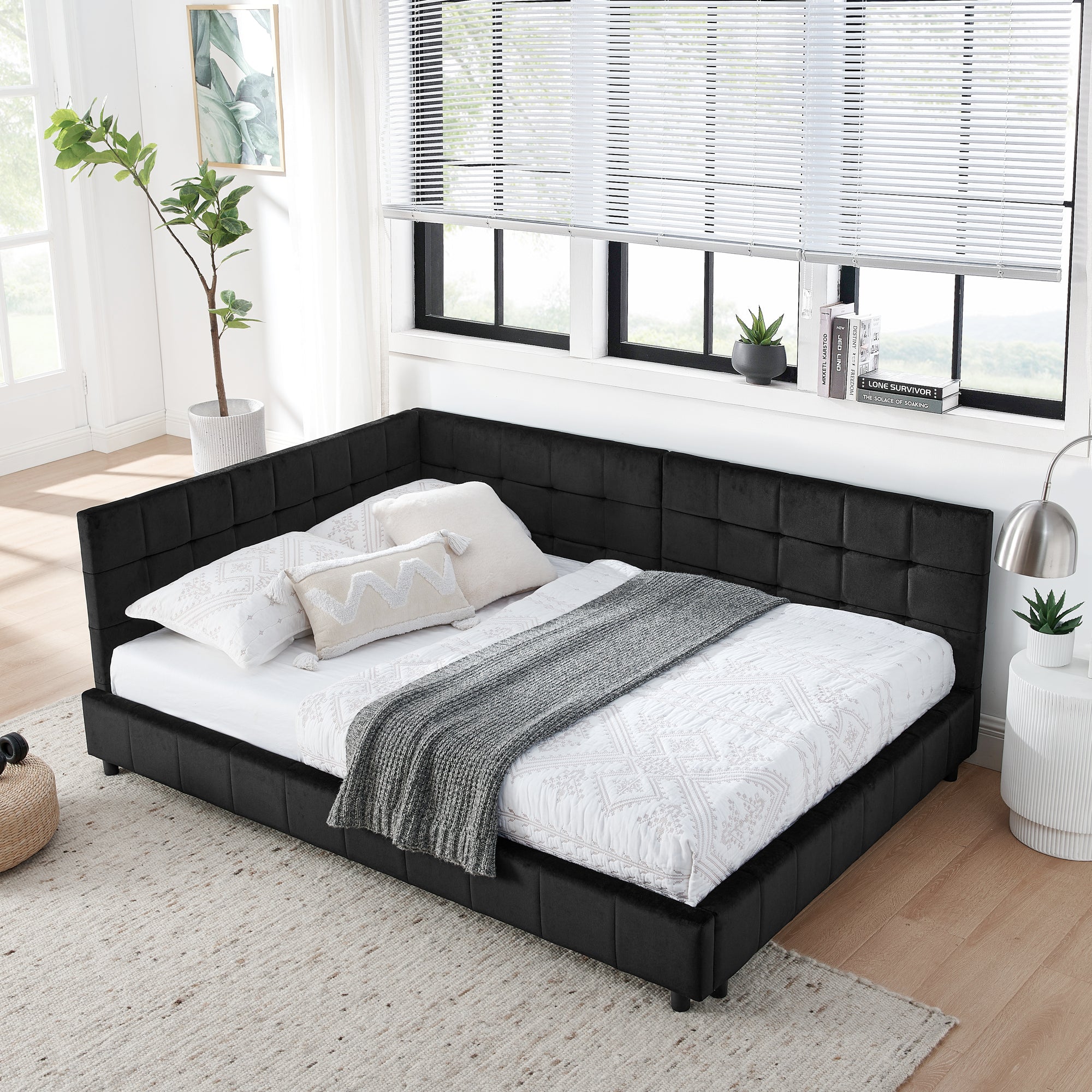Mid-century tufted daybed in black velvet — angle view
