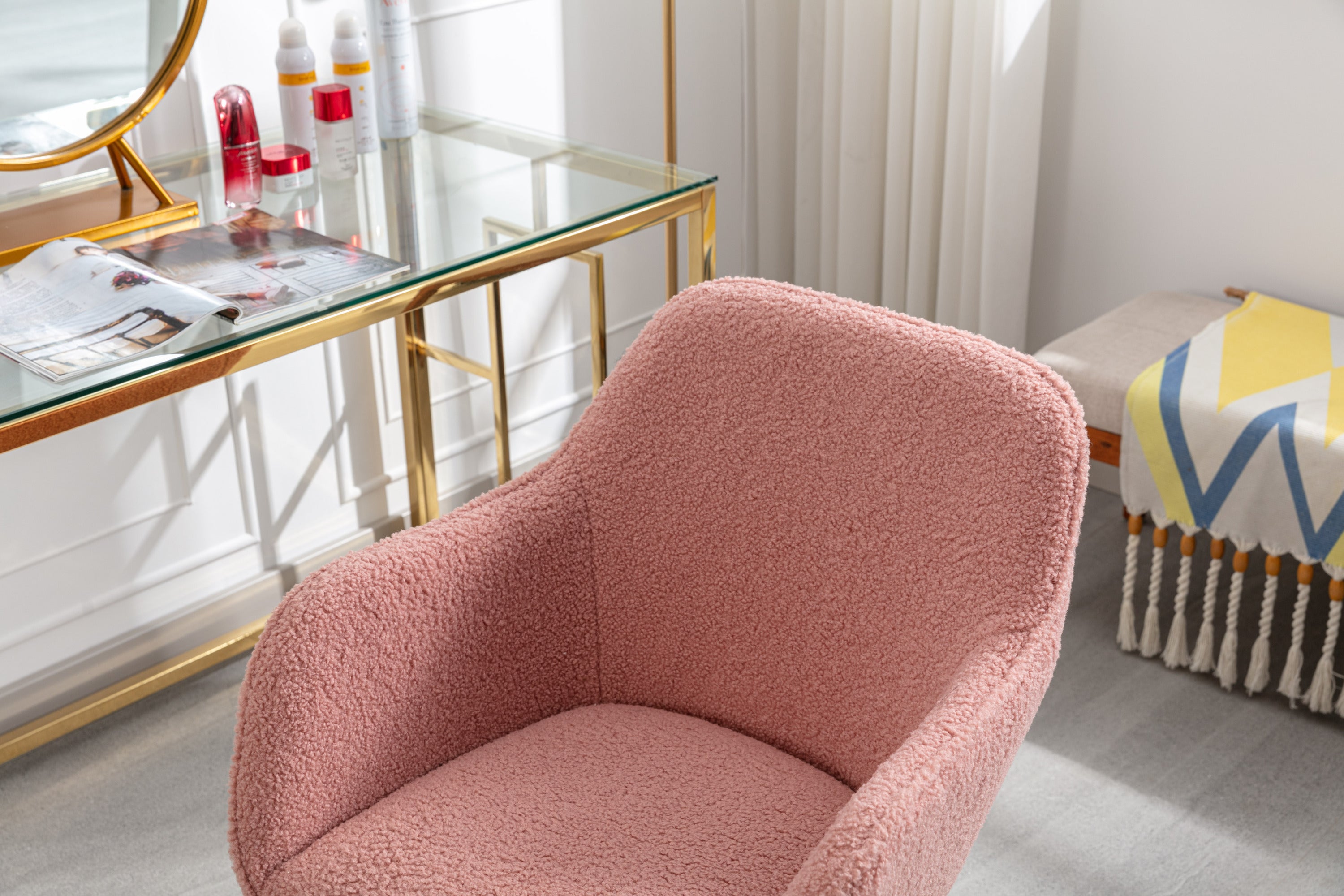 Pink teddy chair wheels and gold metal frame close-up