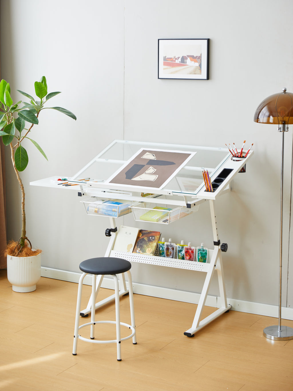 Metal storage strips on side of white drawing desk