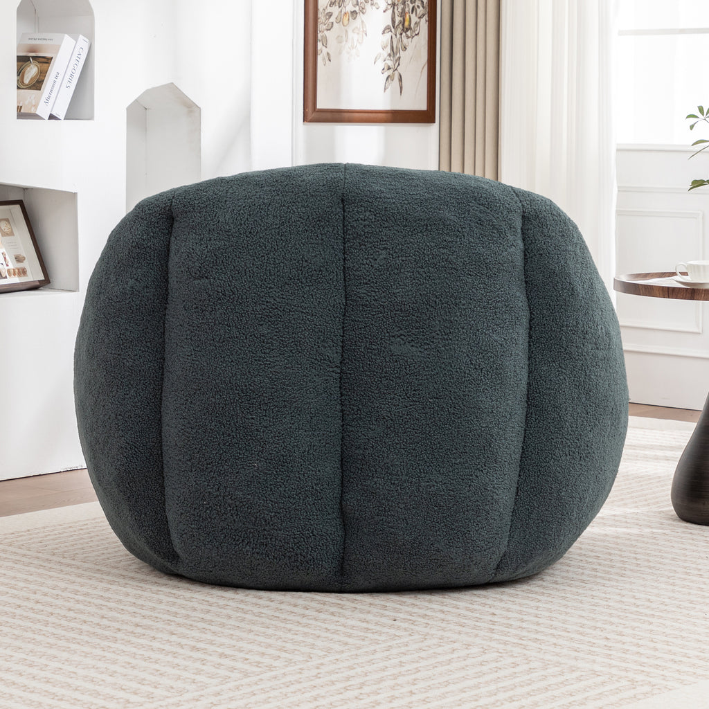 Green bean bag chair in dorm or bedroom setting