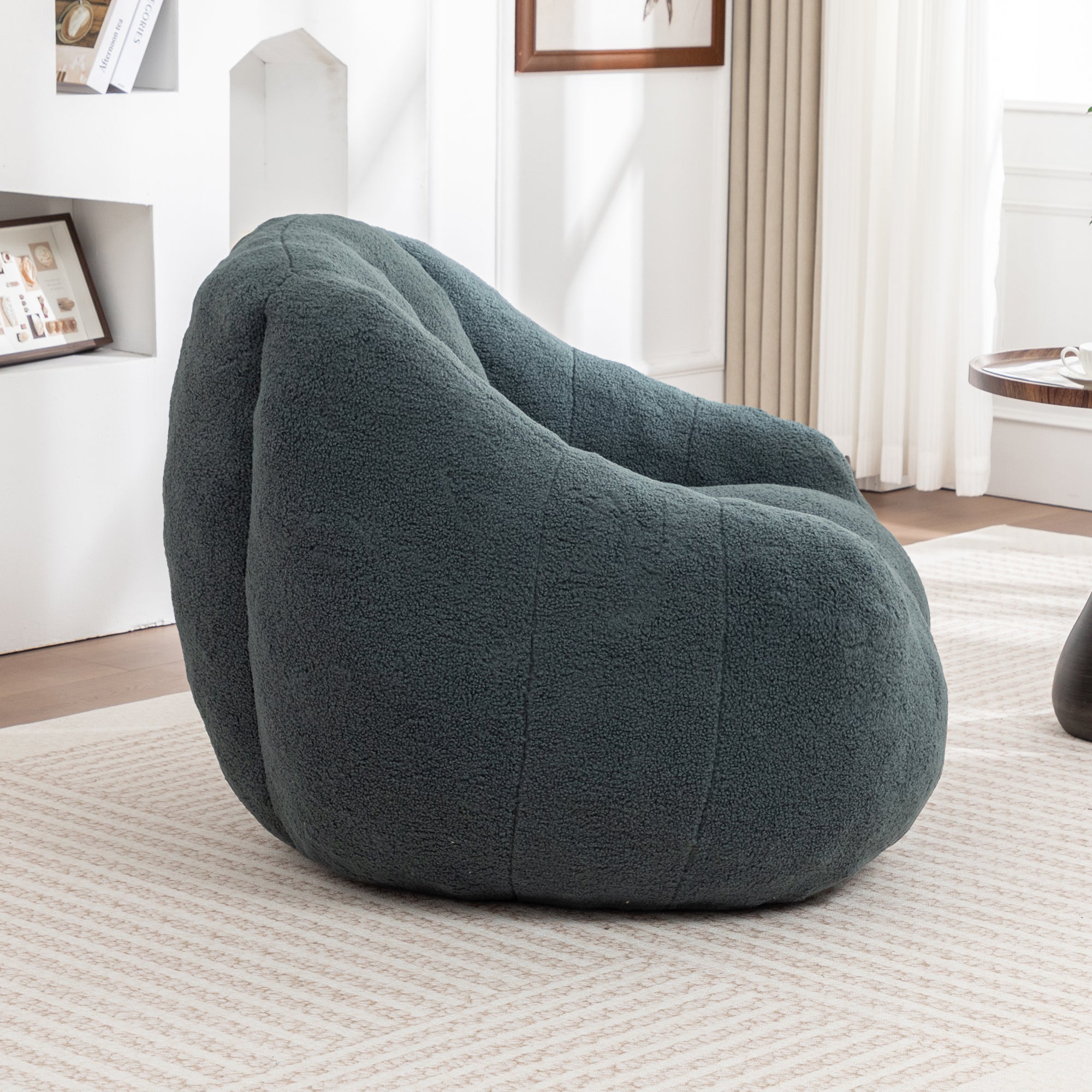 Green bean bag chair with armrests side profile