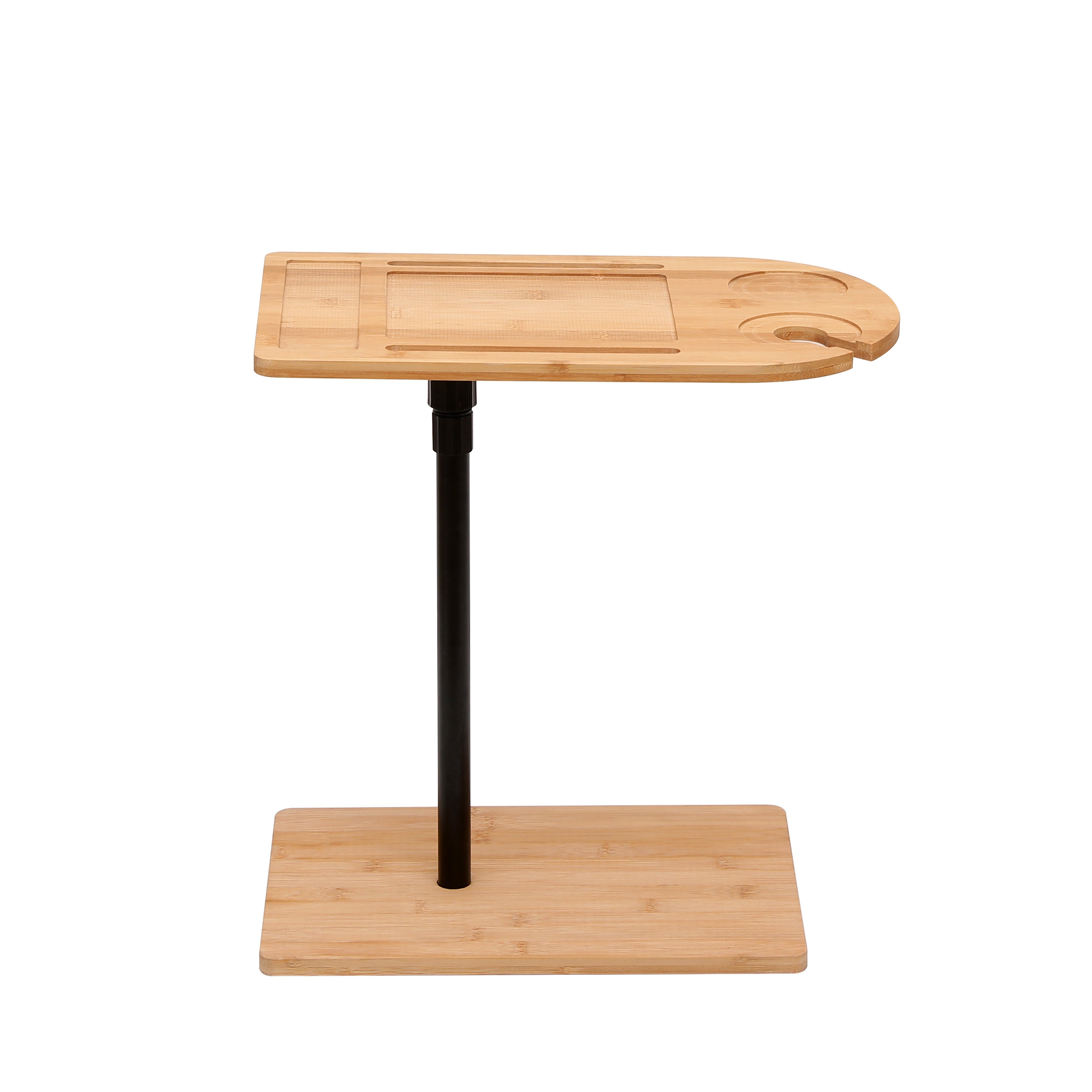 Natural bamboo C-shaped side table used as couch tray table