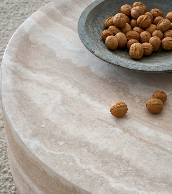 Faux travertine textured round table top detail close-up