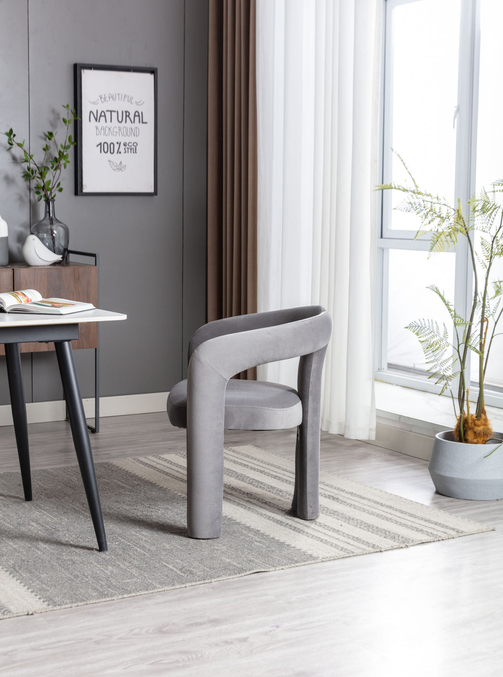 Pair of gray velvet dining chairs at table — lifestyle photo