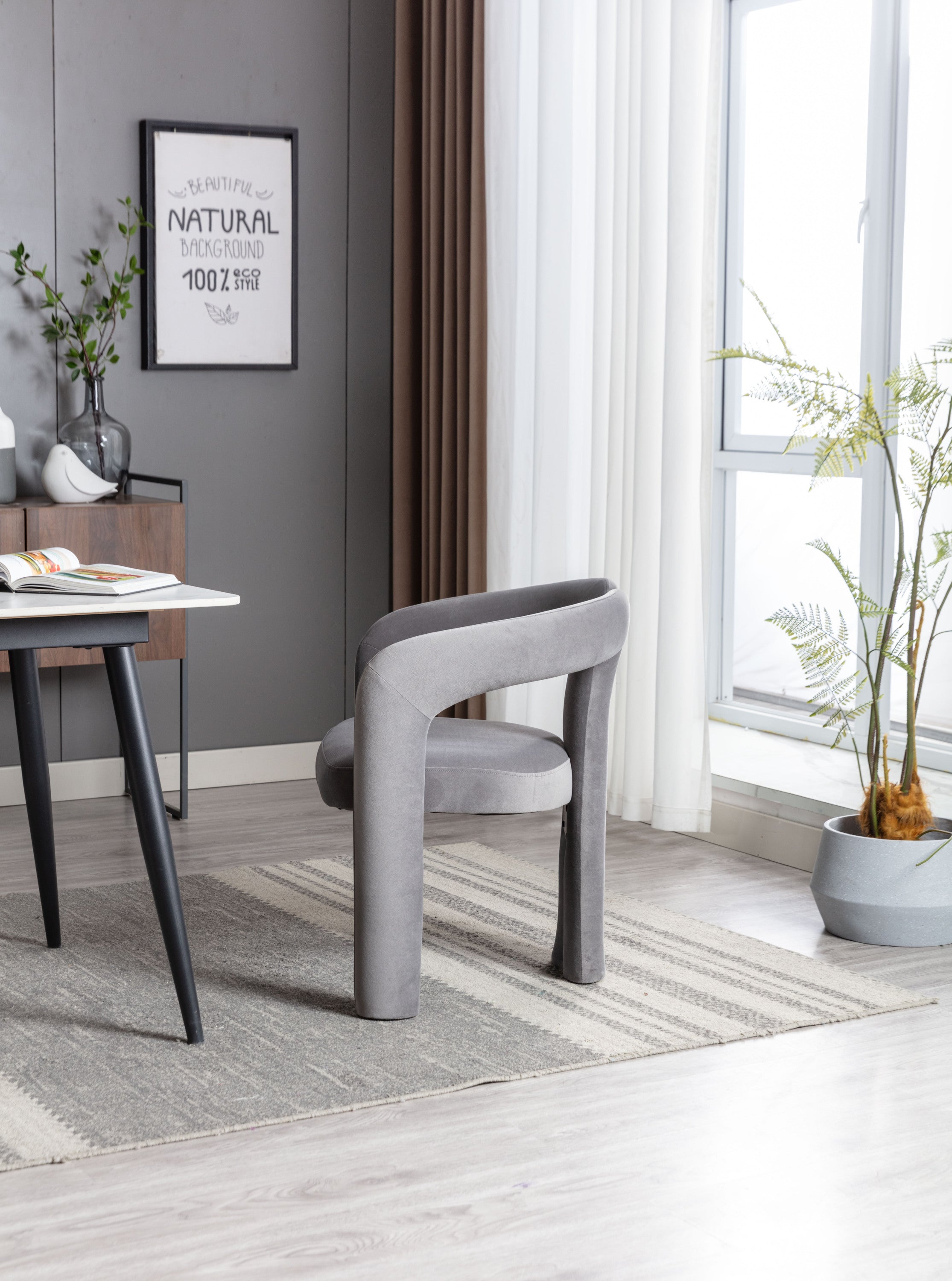 Pair of gray velvet dining chairs at table — lifestyle photo