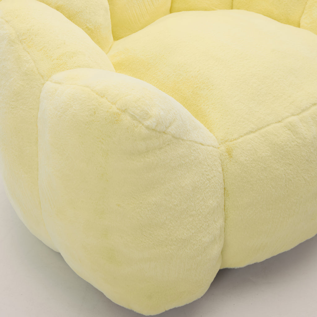 Yellow bean bag sofa in bedroom or dorm setting