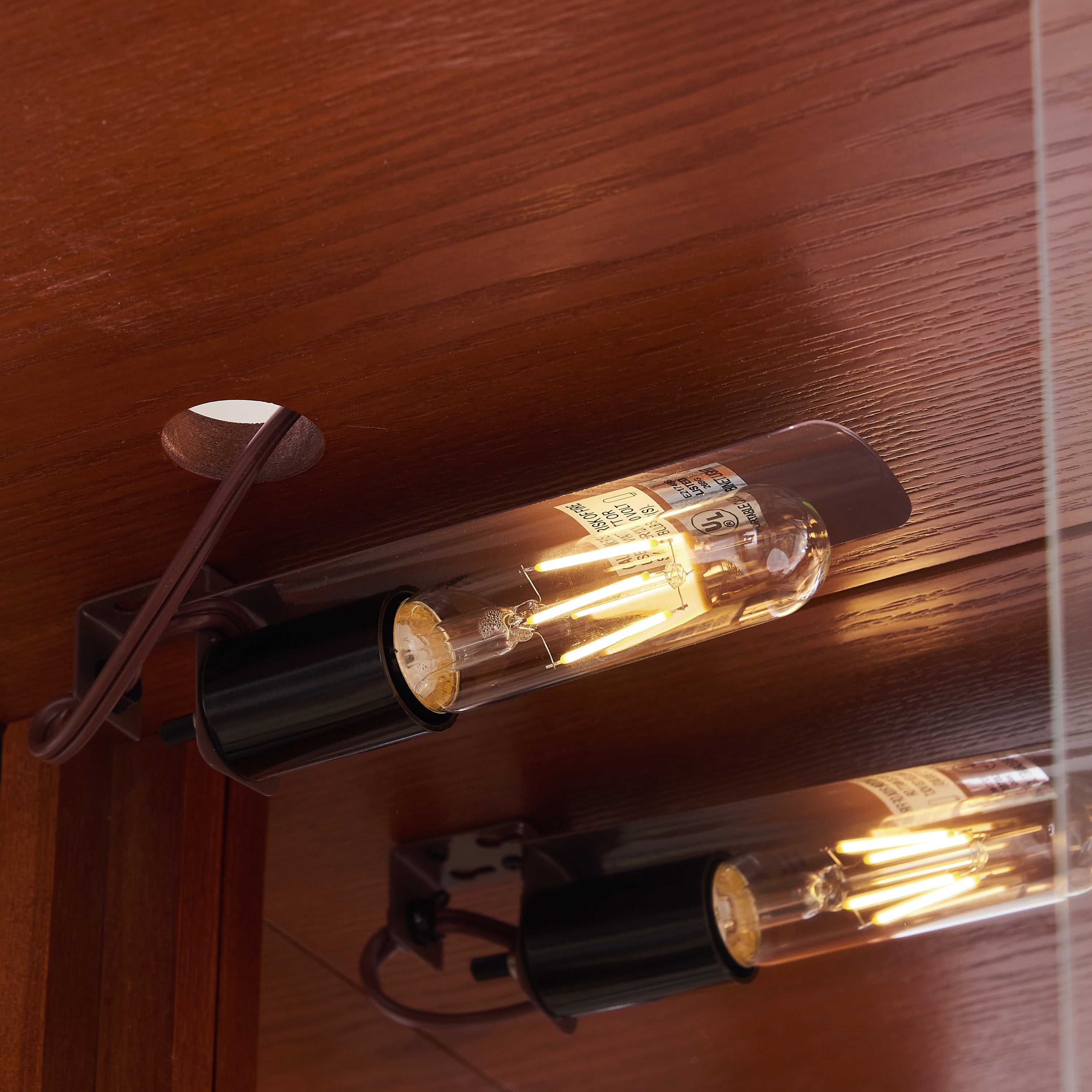 Adjustable glass shelf curio cabinet interior view