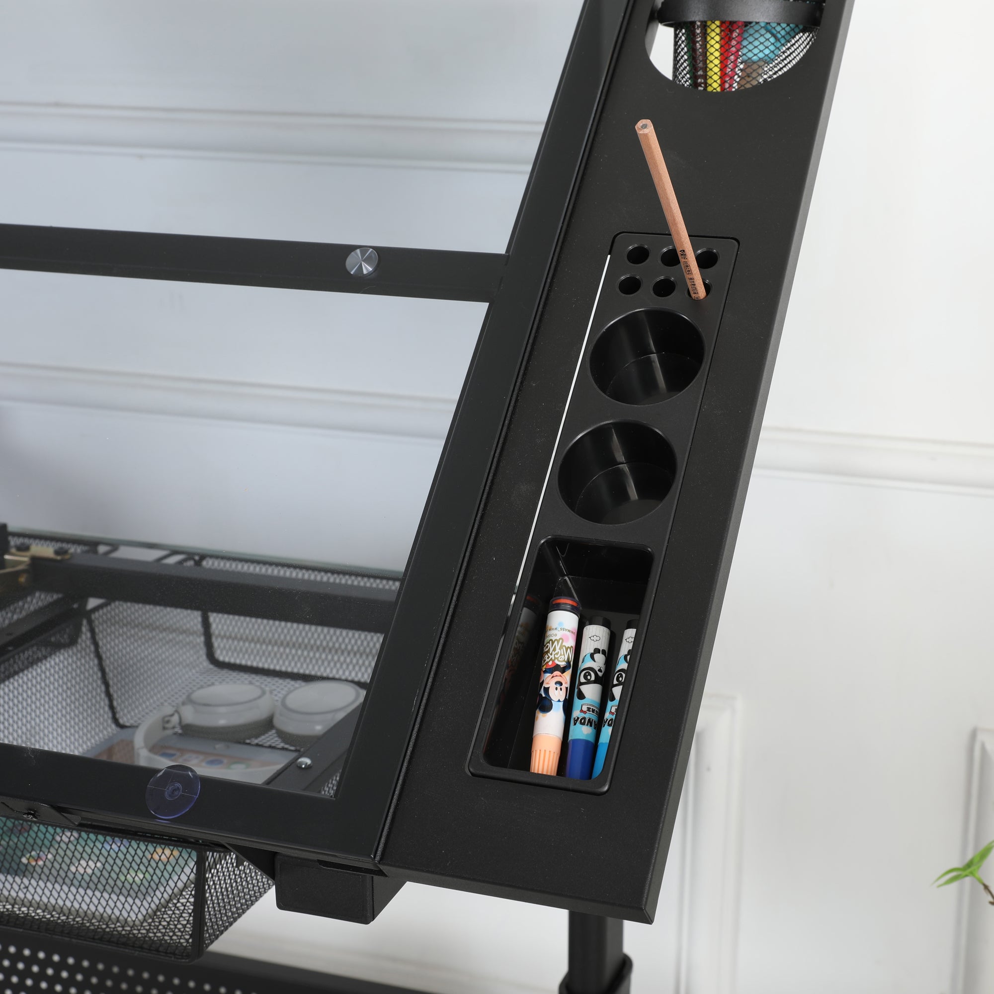 Glass tabletop and metal drawer storage overview