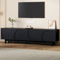 Black arch TV stand with solid wood legs — front view