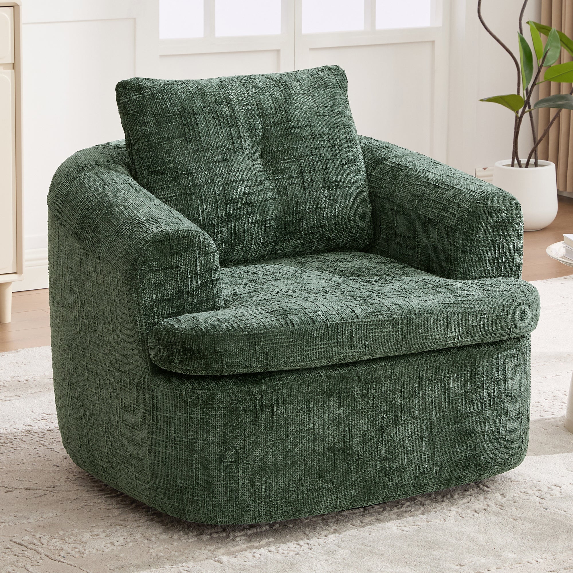Compact green barrel chair 360 degree swivel base — angle view