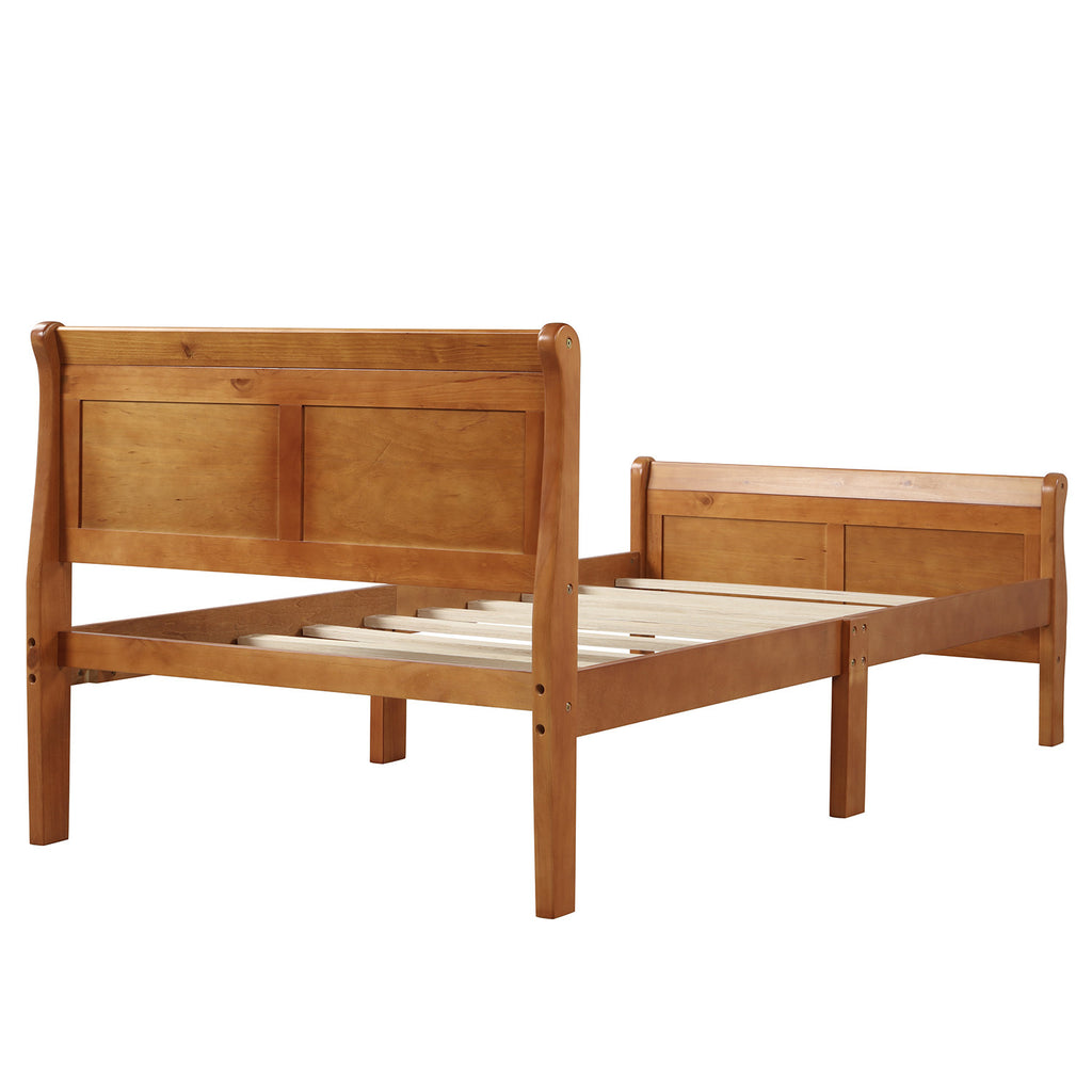 Oak twin sleigh bed in bedroom setting