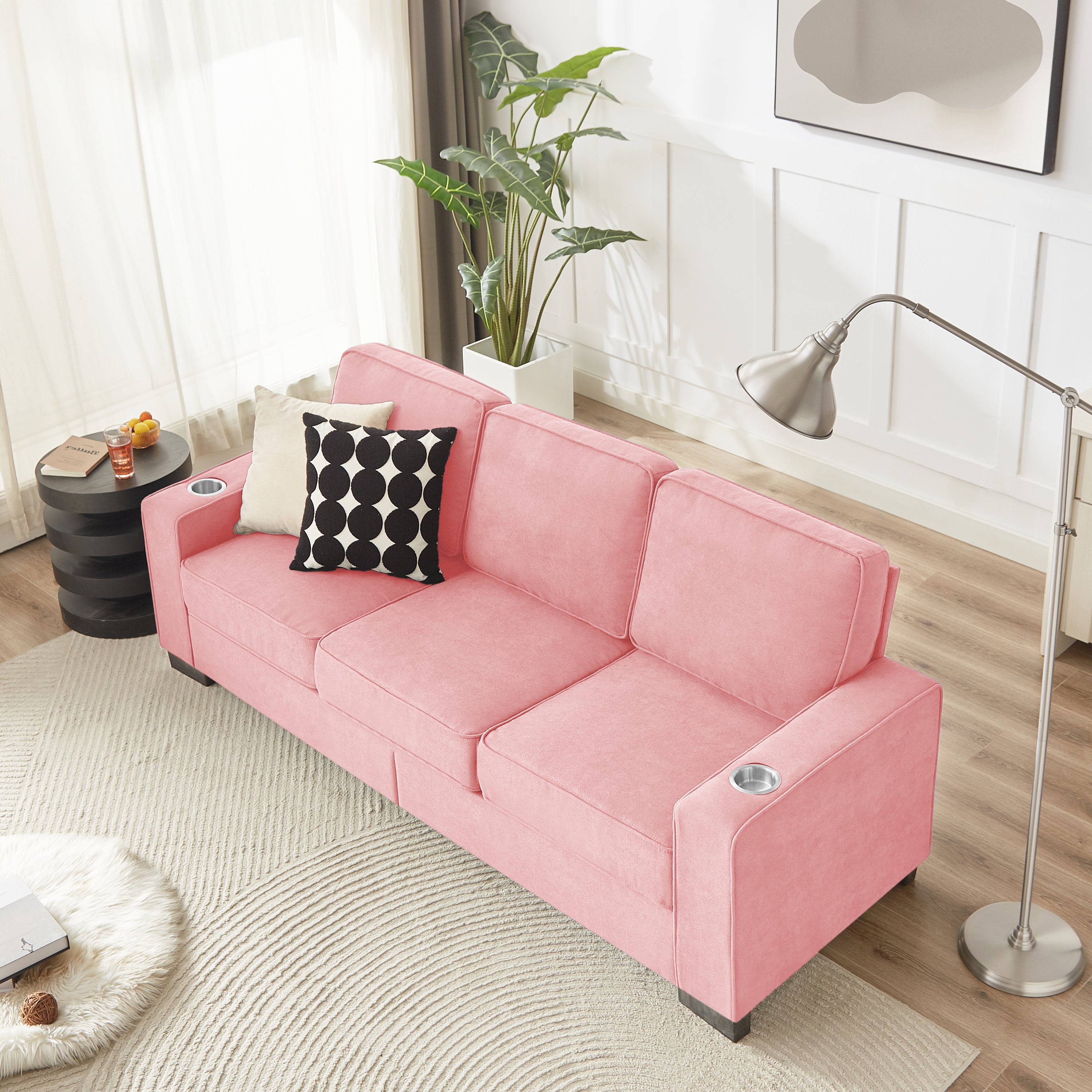 Pink 3-seater sofa in living room setting