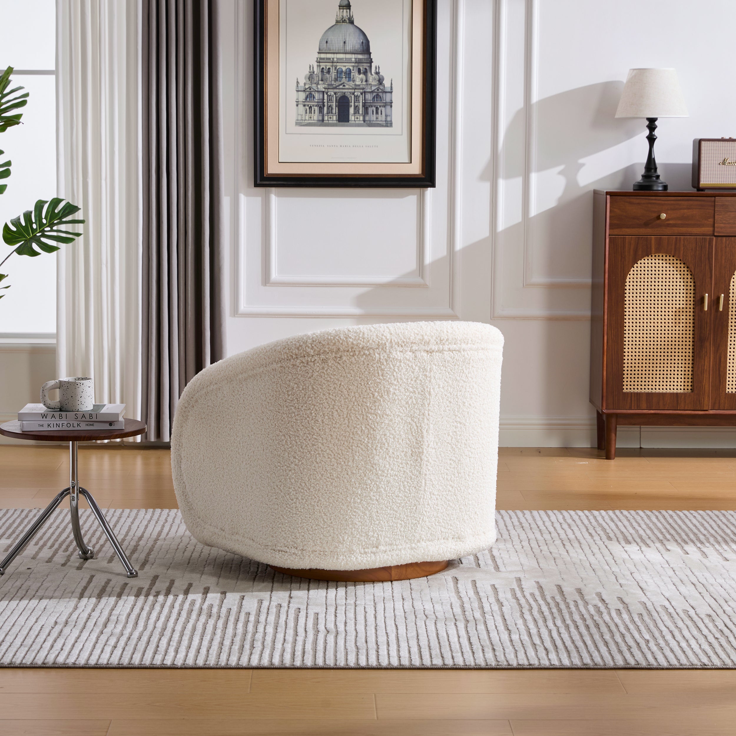 White barrel accent chair round base detail