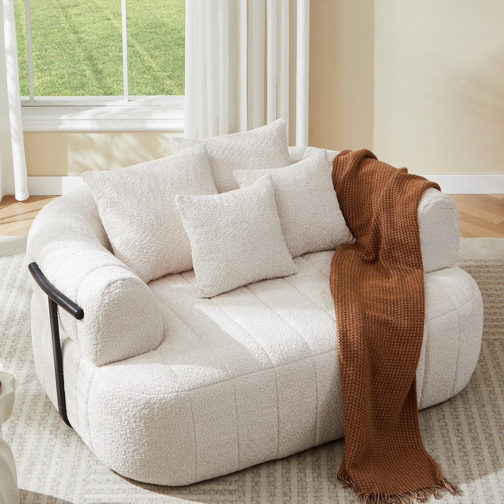 Beige boneless chaise lounge curved arms tufting detail