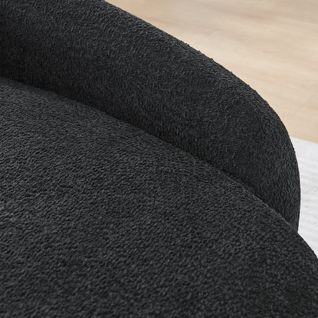 Integrated backrest curve on black bouclé lounge chair