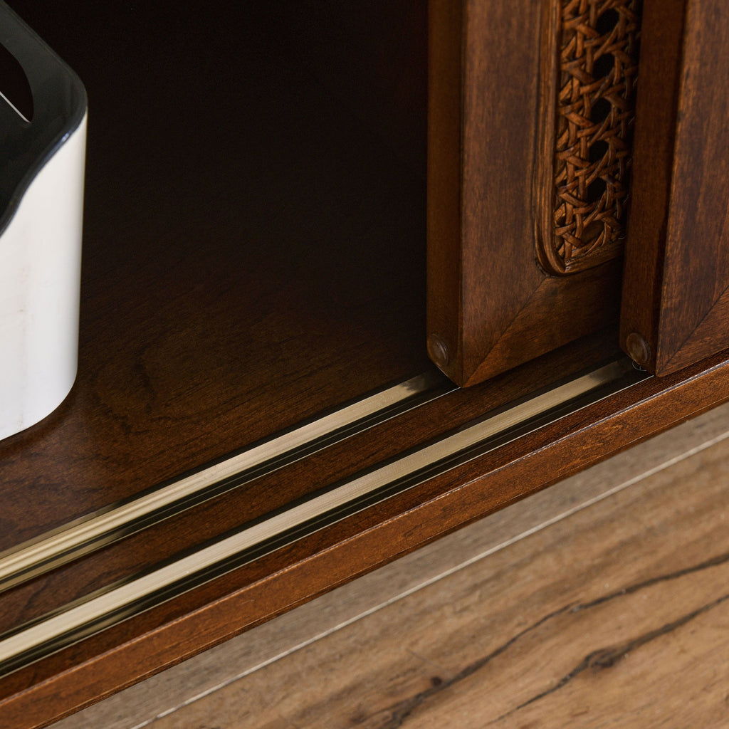Solid wood leg detail on walnut media console