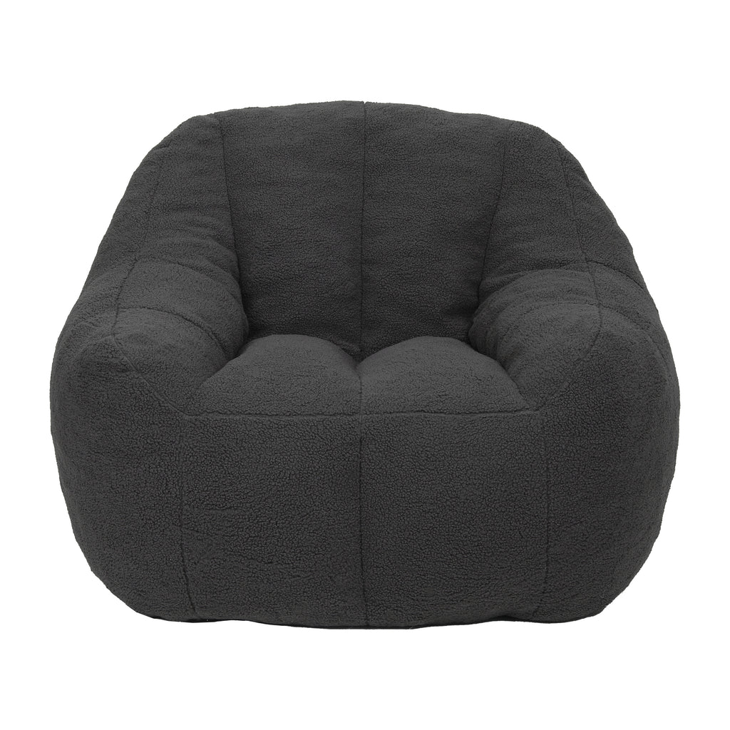 Dark gray bean bag sofa chair in bedroom setting