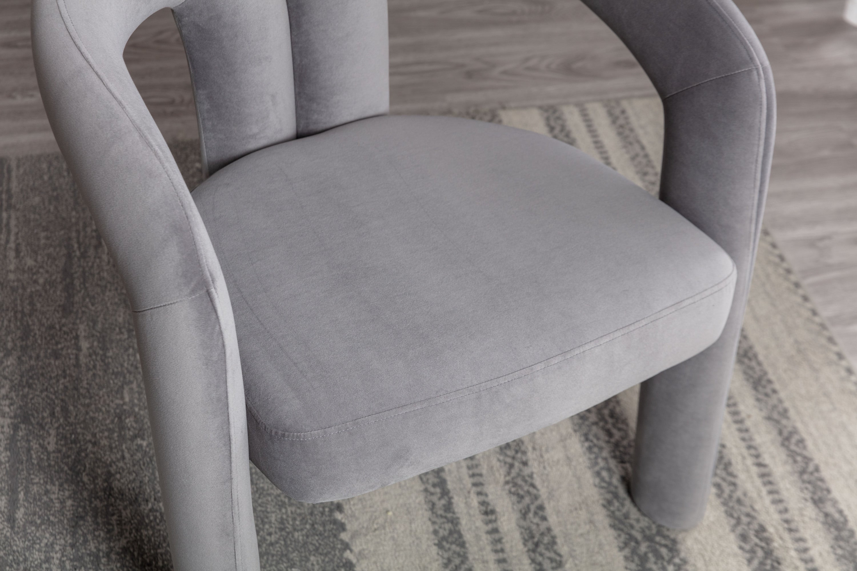 Gray velvet dining chair wooden leg warmer detail