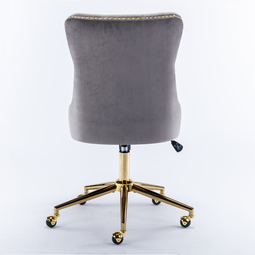 Button-tufted gray velvet seat and back close-up