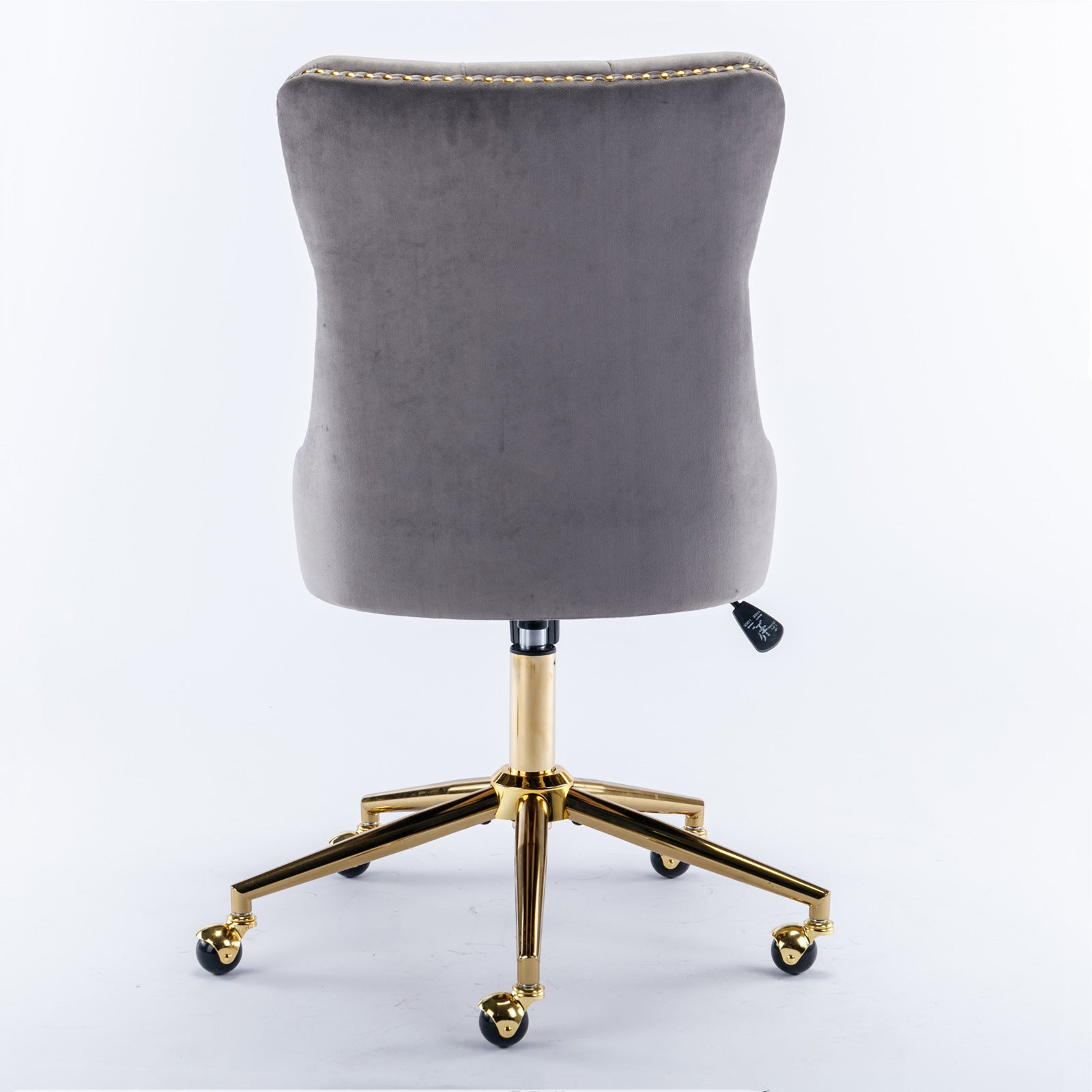 Button-tufted gray velvet seat and back close-up
