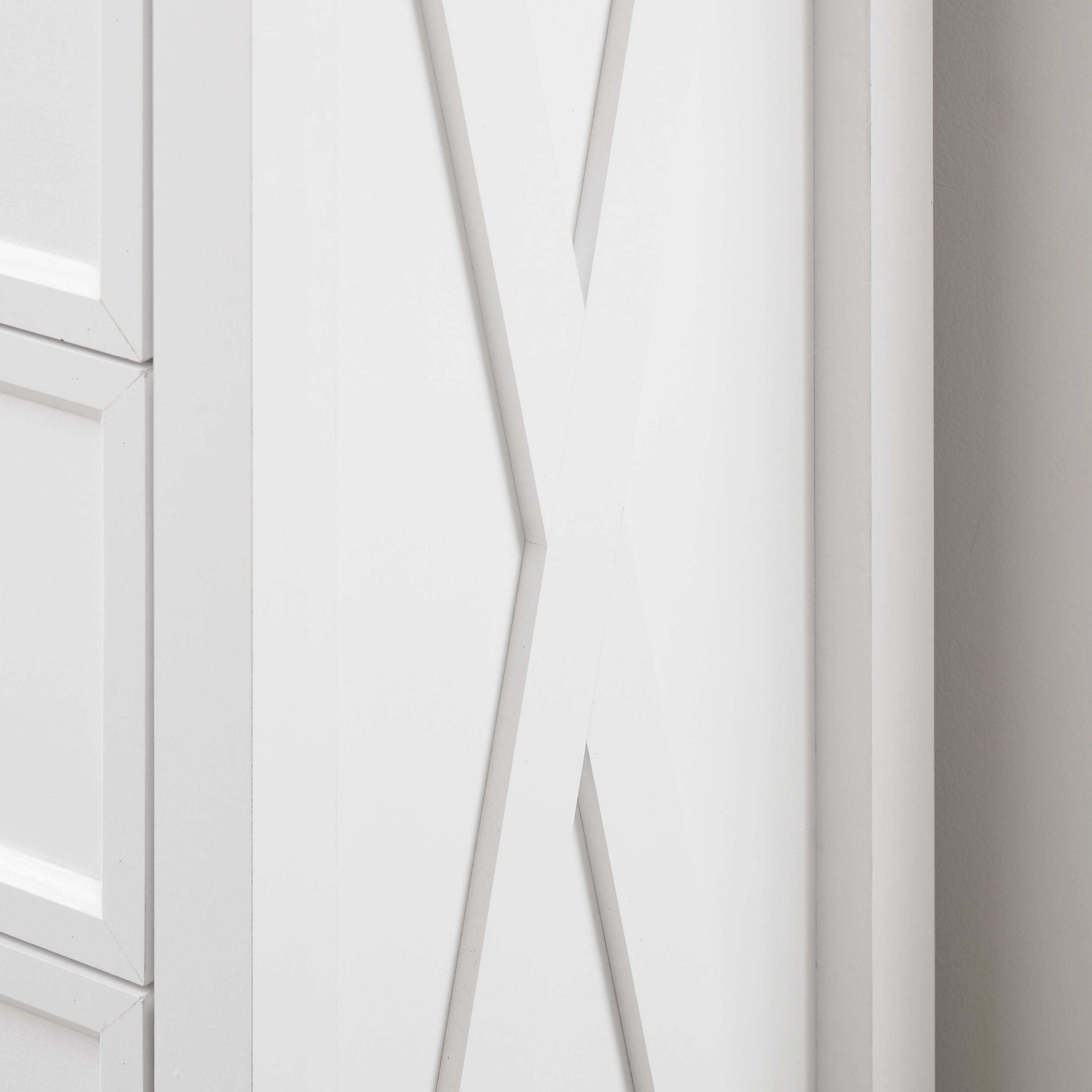 Anti-tipping wall-mount safety device on tall dresser