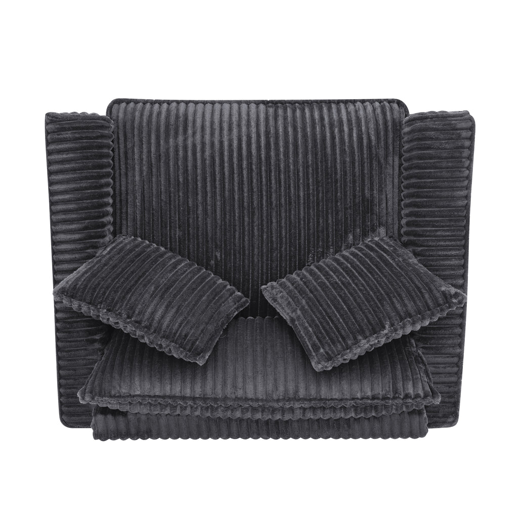 Gray tufted lazy sofa chair in bedroom corner