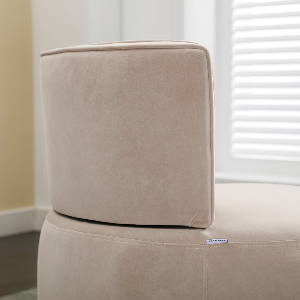 Beige velvet chair in living room setting