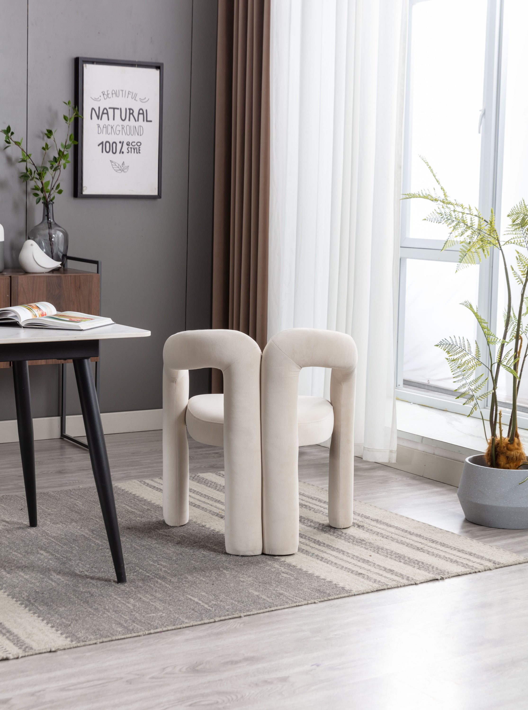 Pair of beige velvet chairs side by side