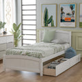 White twin platform bed with two drawers — front view
