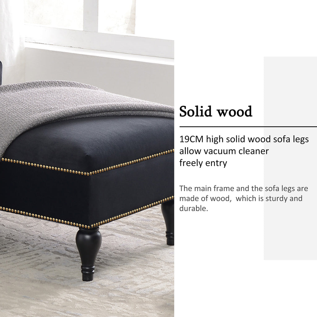 Black velvet chaise lounge in living room setting