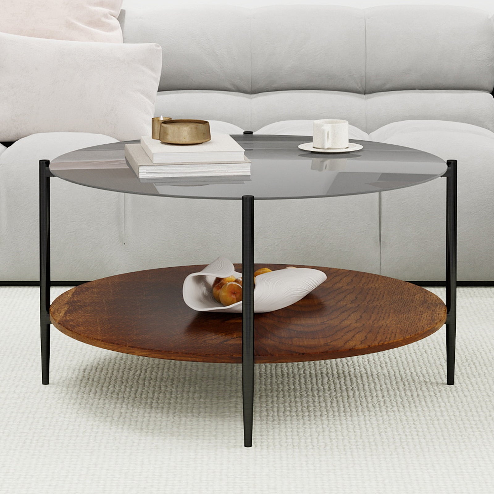 Modern round coffee table black glass top black metal legs — angle view