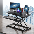 Black 32-inch height-adjustable desk converter — front view