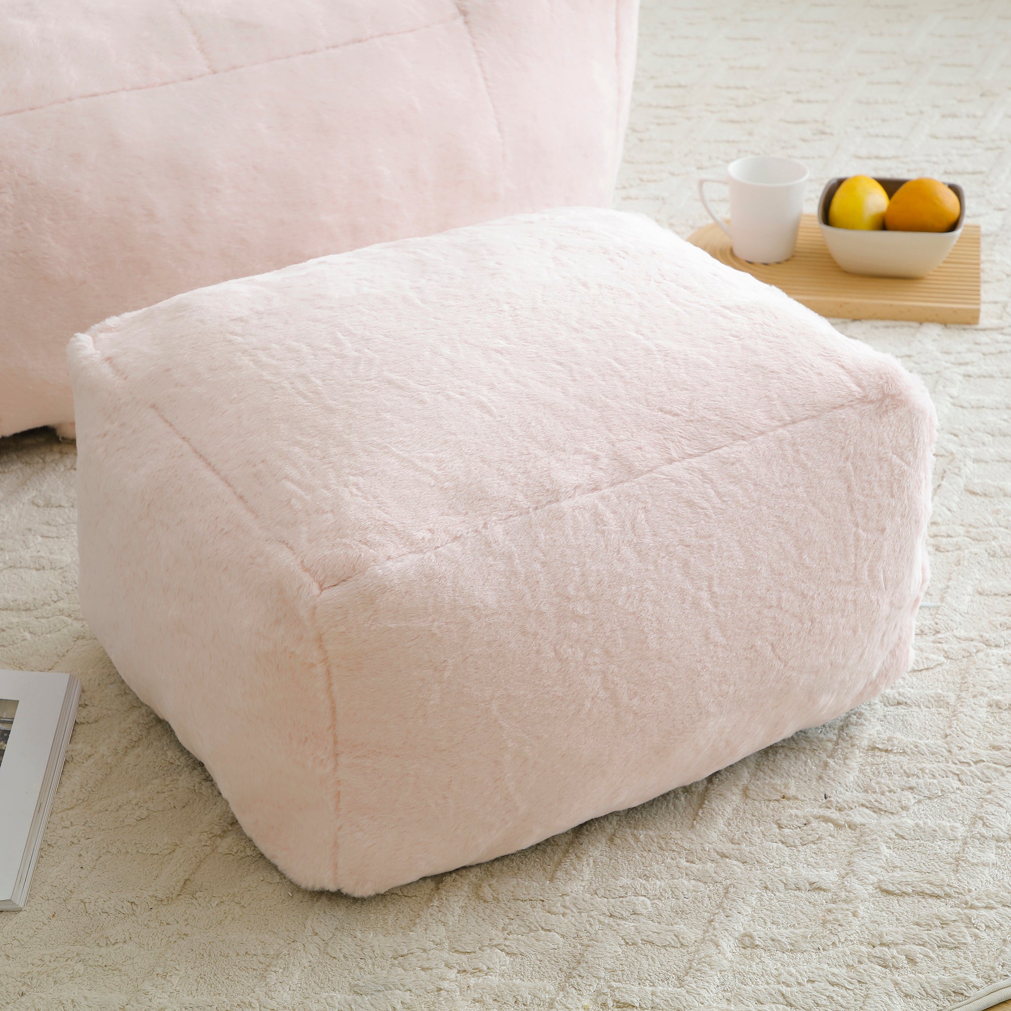 Ergonomic backrest on pink shell bean bag chair