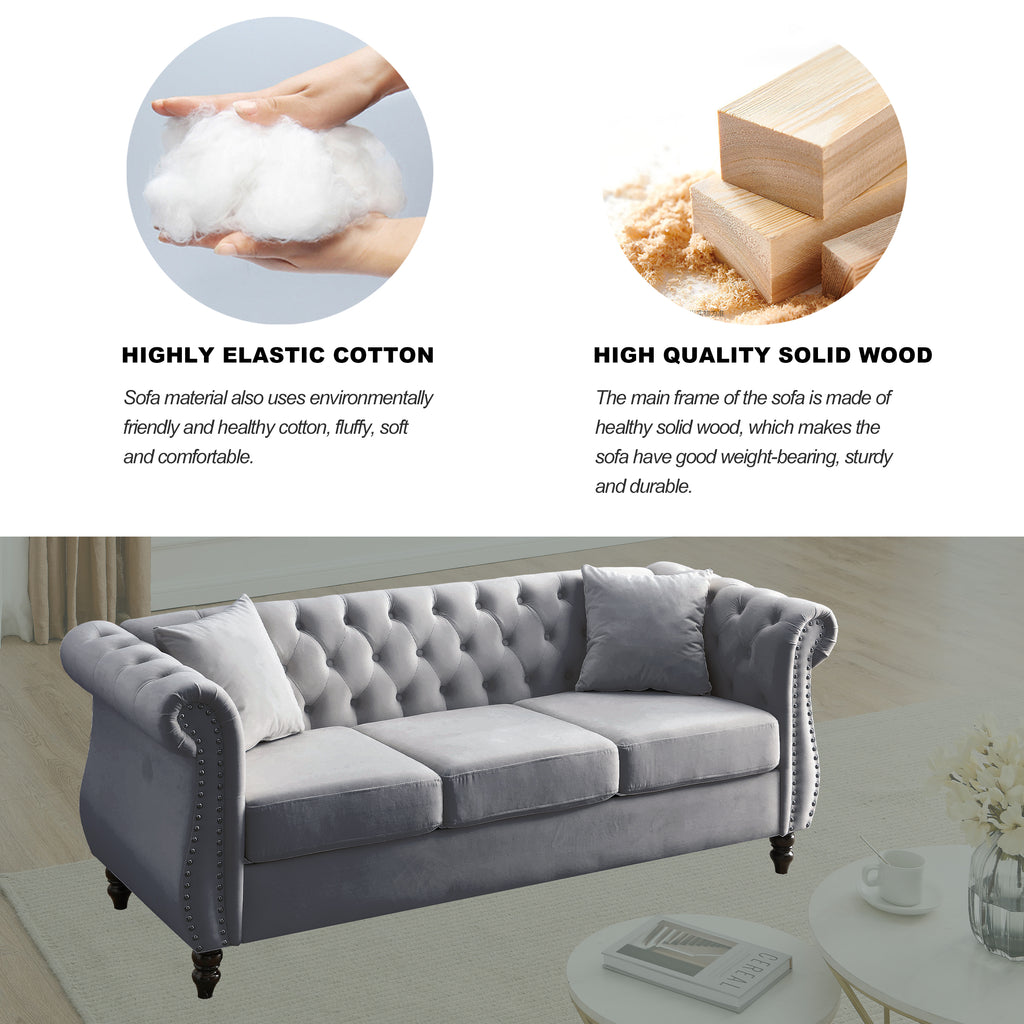 Grey velvet sofa with included pillows