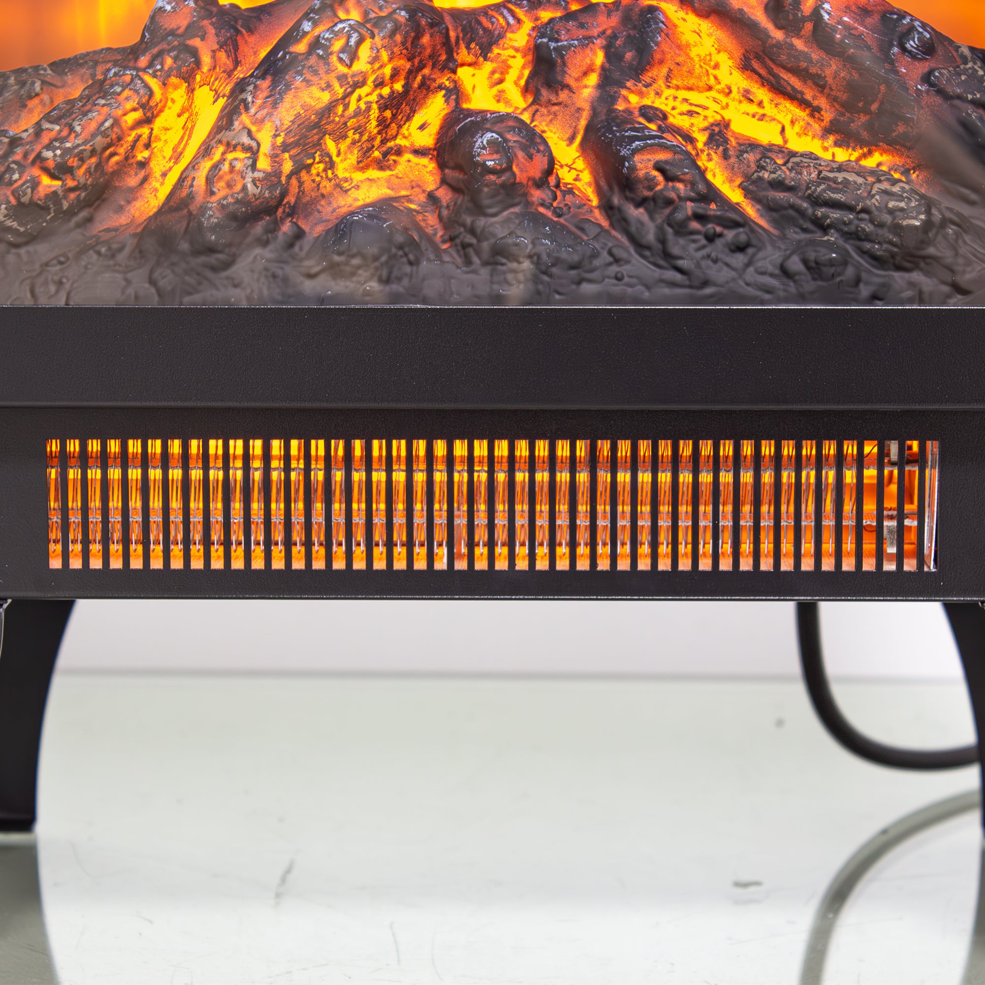 Matte black electric fireplace stove tapered leg base detail
