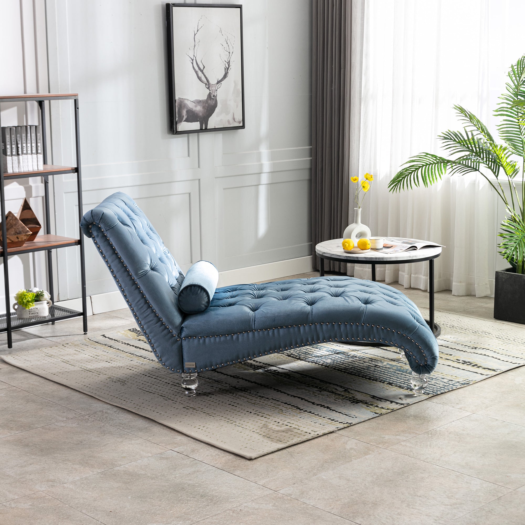 Light blue velvet chaise in living room setting