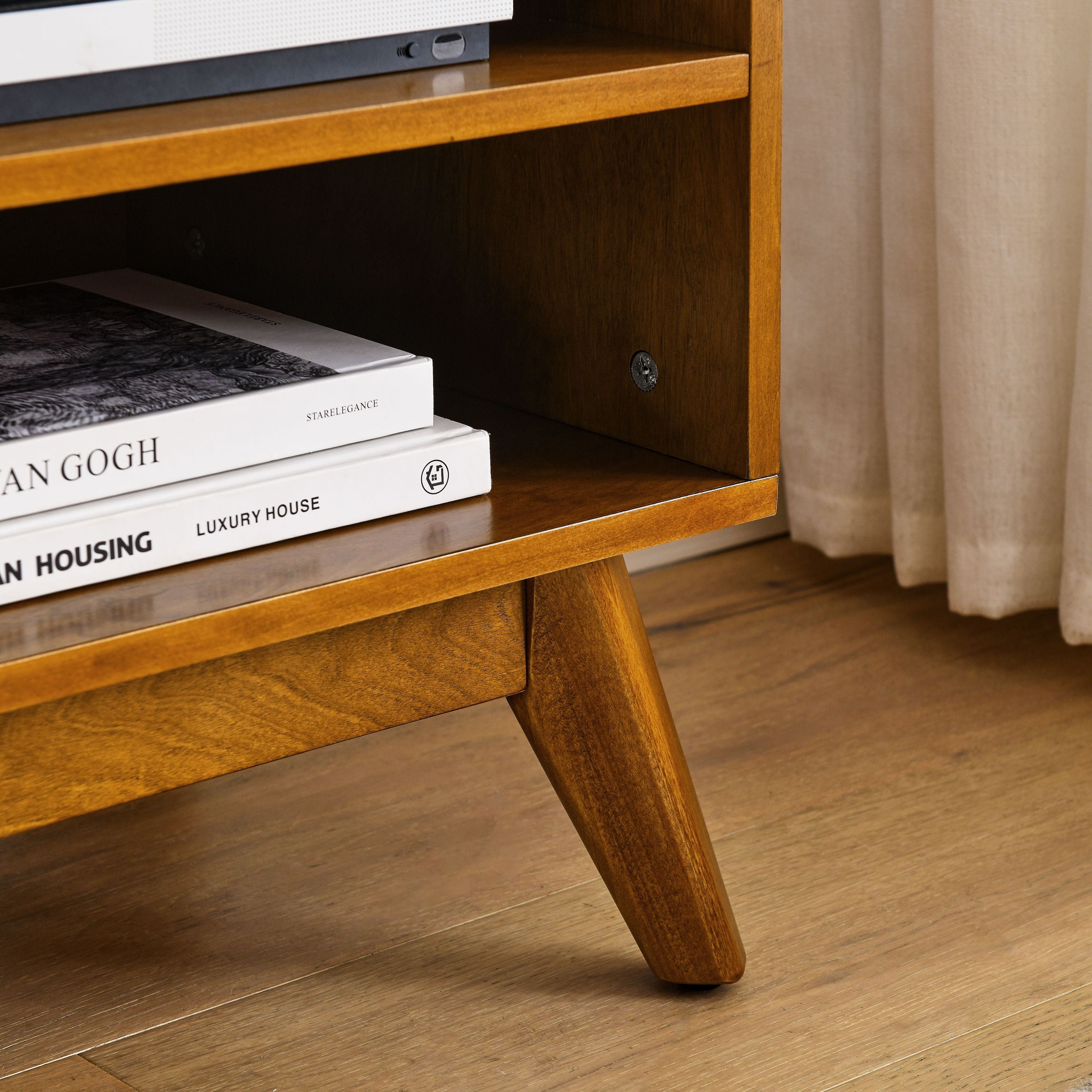Rattan-trimmed sliding doors on light wood TV cabinet