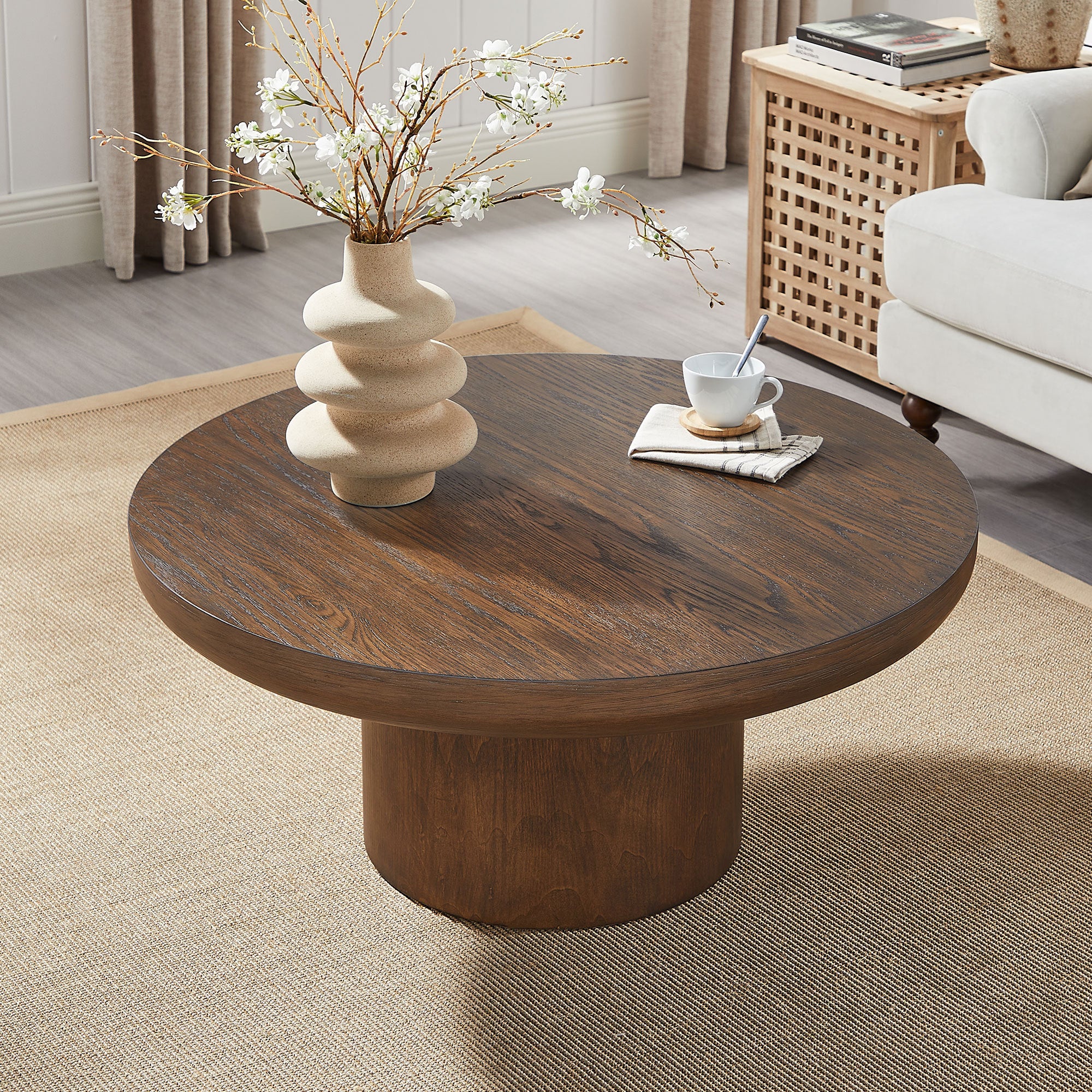 Cylindrical oak leg construction on round coffee table
