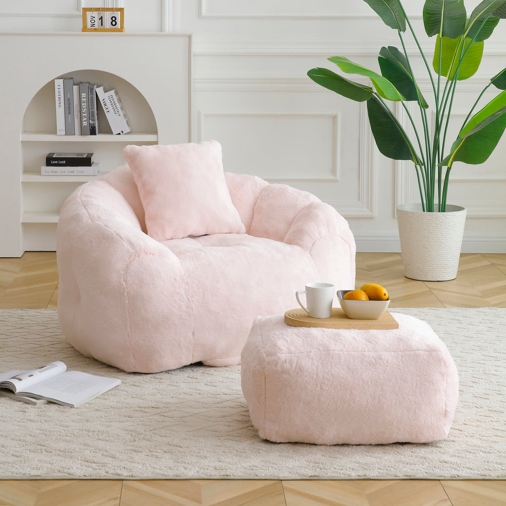 Pink faux fur shell-shaped giant bean bag chair with footstool — front view