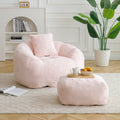 Pink faux fur shell-shaped giant bean bag chair with footstool — front view
