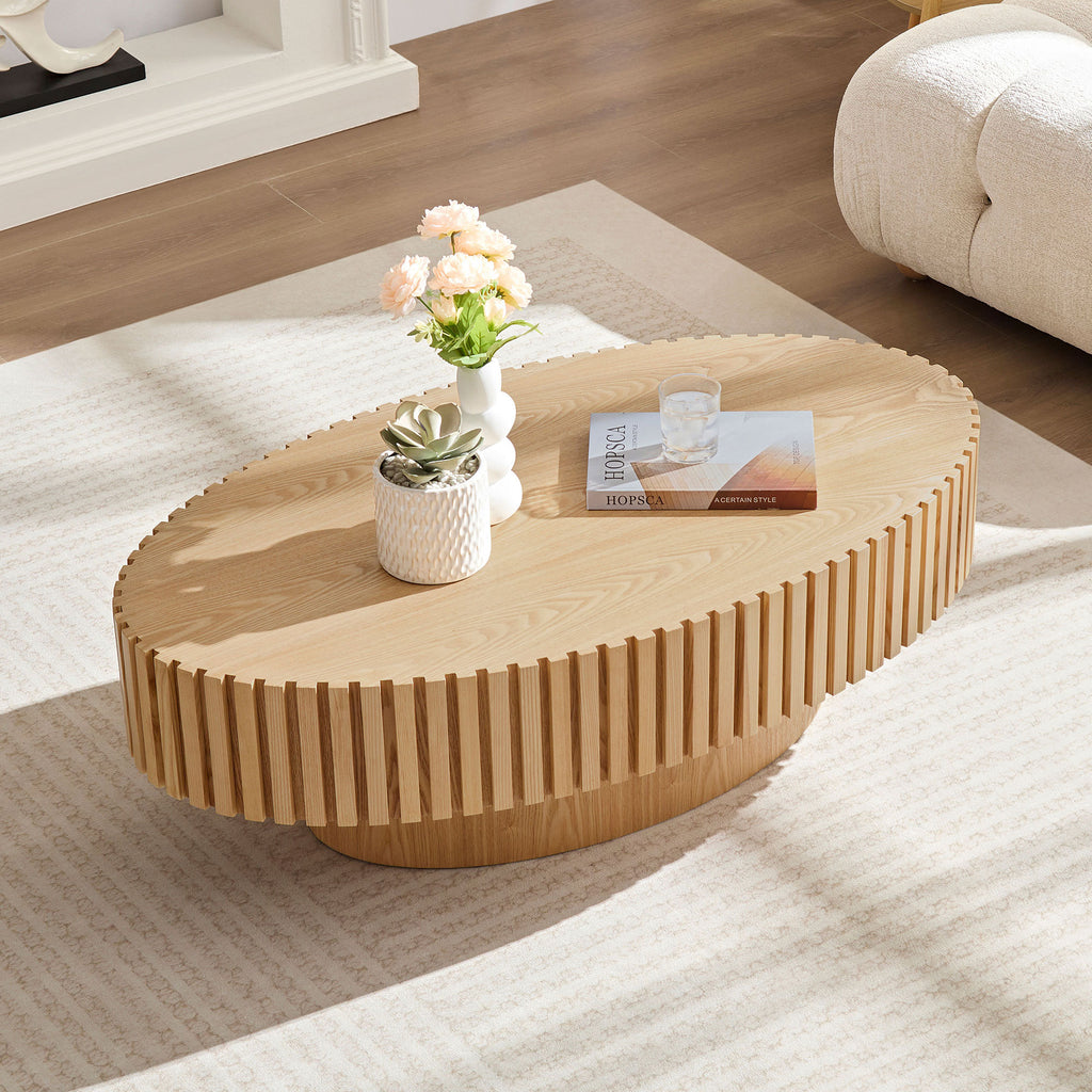 Modern oval coffee table in living room setting