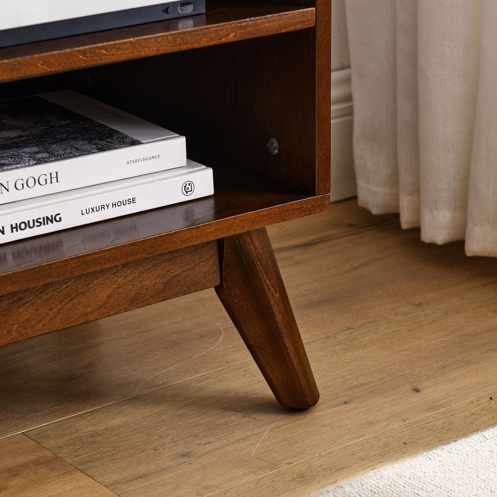 Rattan-trimmed sliding doors on walnut TV cabinet
