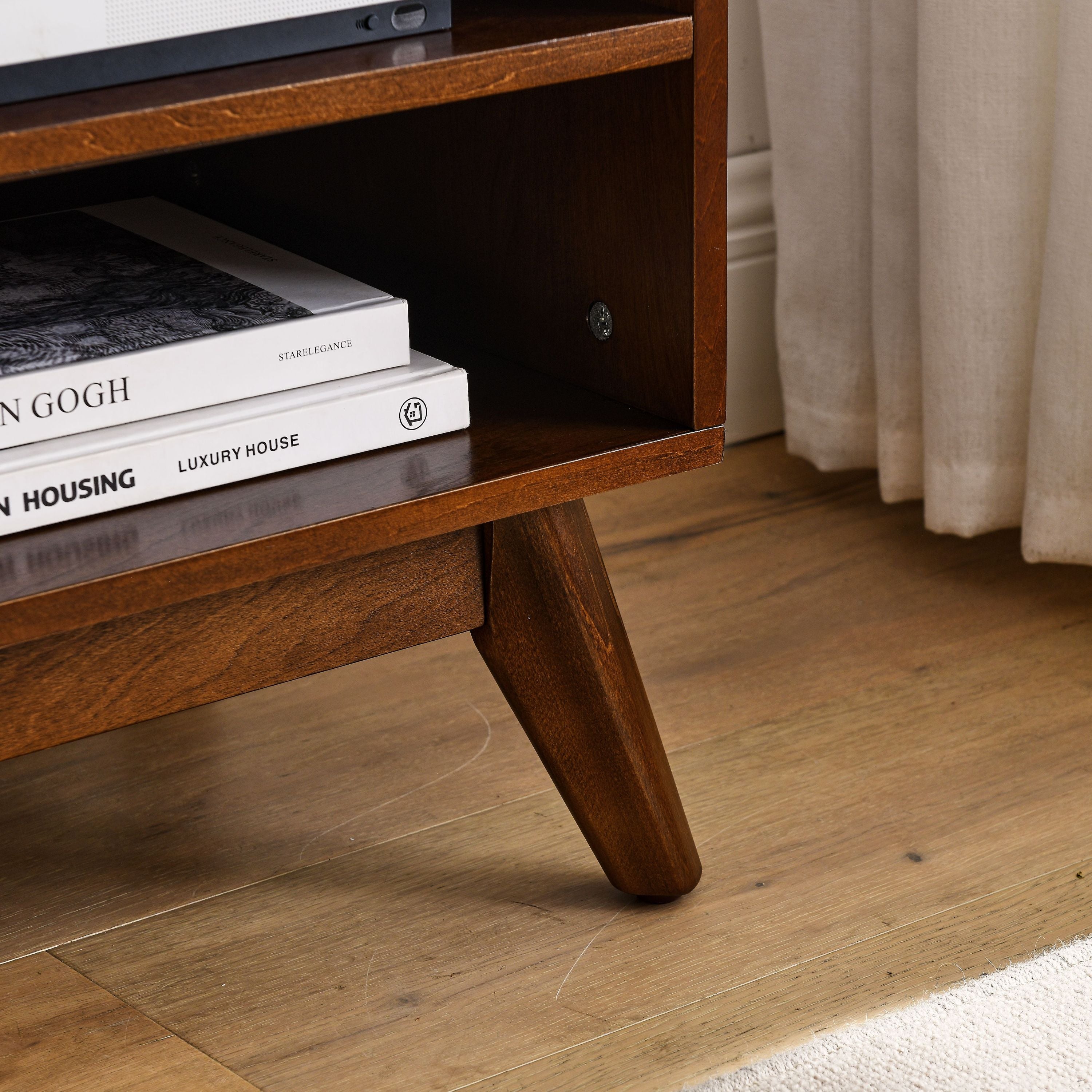Rattan-trimmed sliding doors on walnut TV cabinet